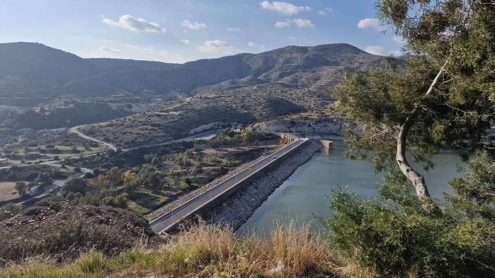 The Germasogeia Dam and its reservoir among green hills