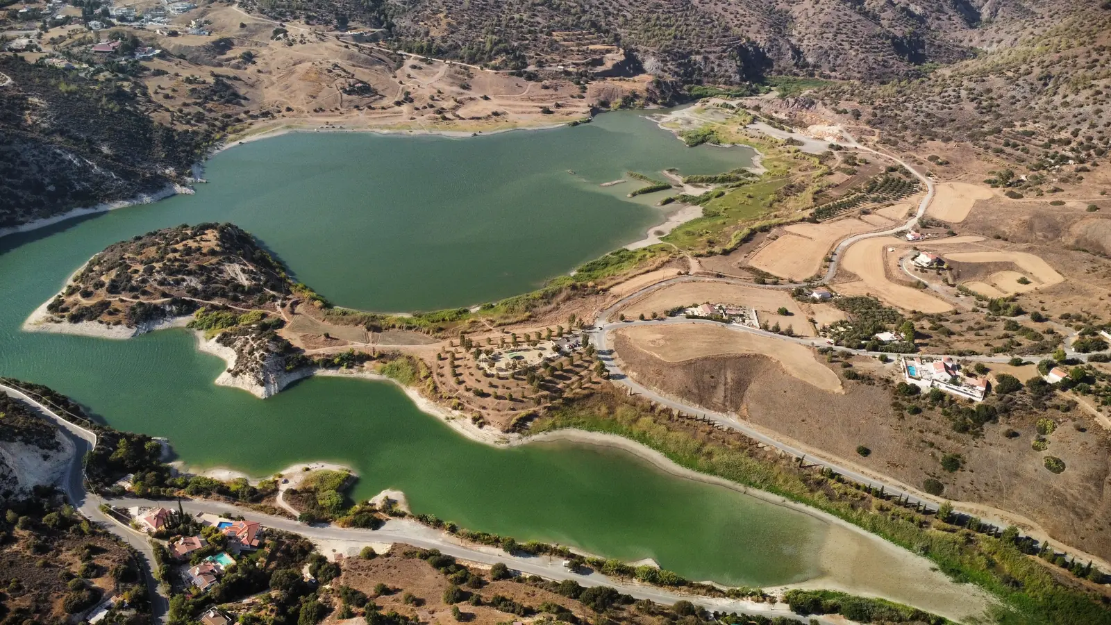 Aerial view over the Germasogeia reservoir, hiking trails and countryside